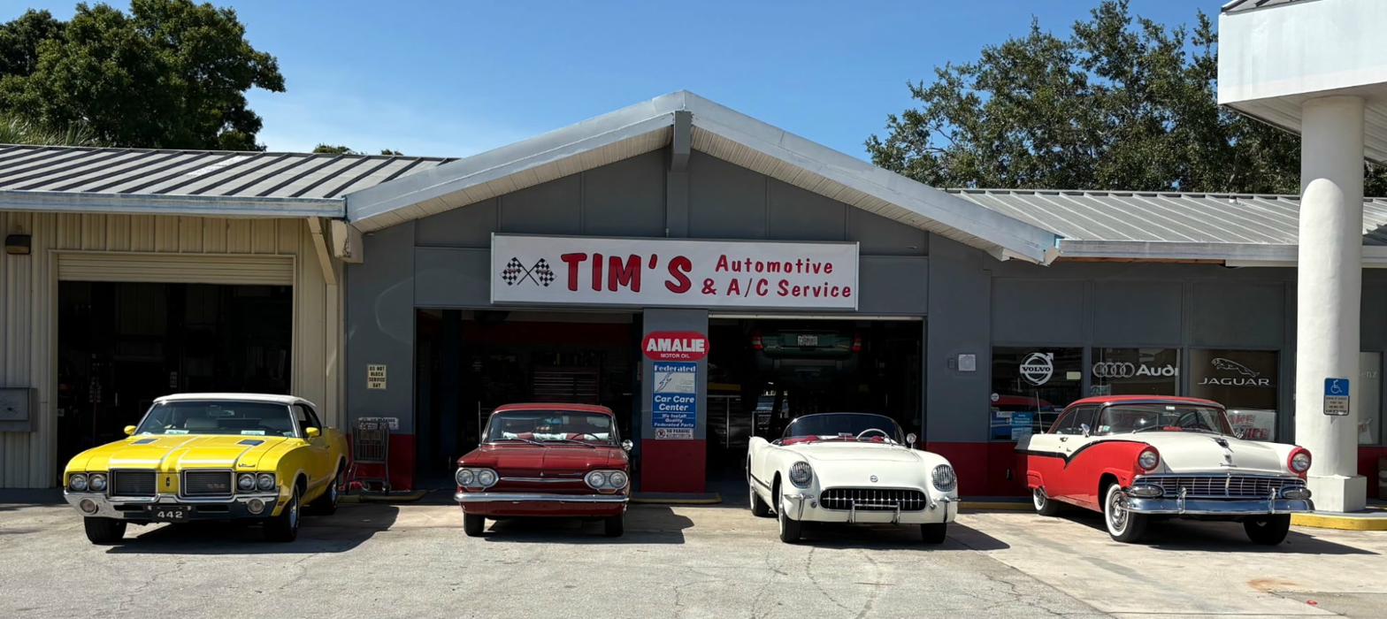 Tim and team with National Championship racing banner